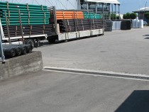 The channels are exposed to daily forklift traffic carrying multi-tonne loads in both lateral and alongside directions.